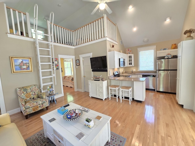 1 Old County Rd Unit 155, Wells, ME 04090 - living area featuring plenty of natural light, high vaulted ceiling, and light wood-type flooring