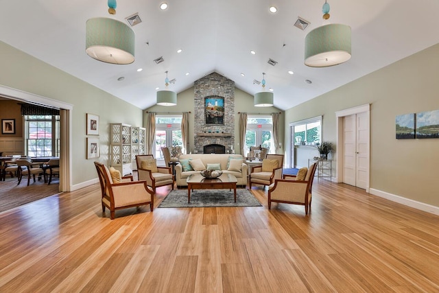 1 Old County Rd Unit 155, Wells, ME 04090 - living room featuring vaulted ceiling, light wood-style floors, a stone fireplace, baseboards, and recessed lighting