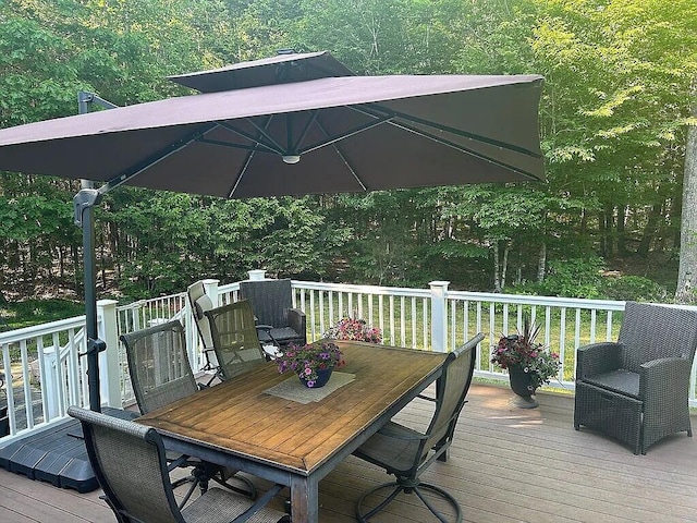 9 Deerfield Dr, Brunswick, ME 04011 - deck featuring outdoor dining space and a wooded view
