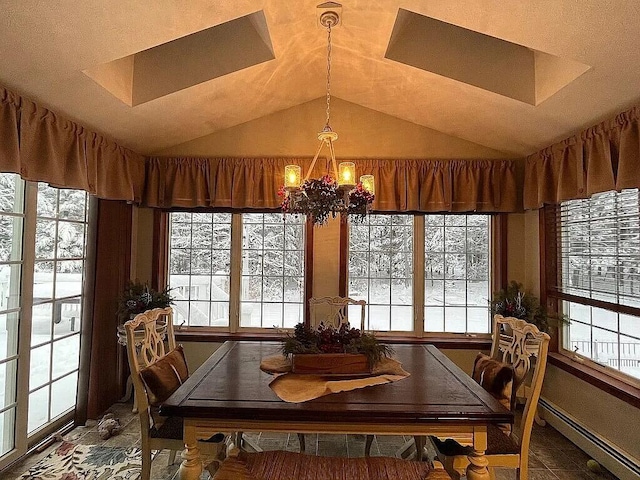 9 Deerfield Dr, Brunswick, ME 04011 - dining area with a chandelier, healthy amount of natural light, a skylight, and vaulted ceiling
