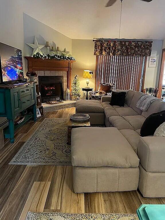 9 Deerfield Dr, Brunswick, ME 04011 - living room with wood finished floors and a fireplace with raised hearth