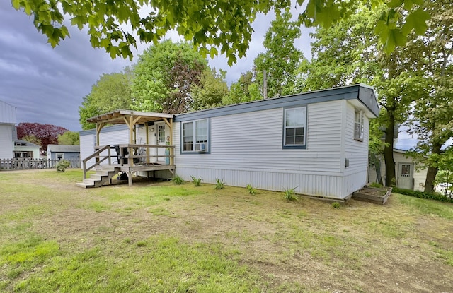 view of front of property featuring a wooden deck and a pergola