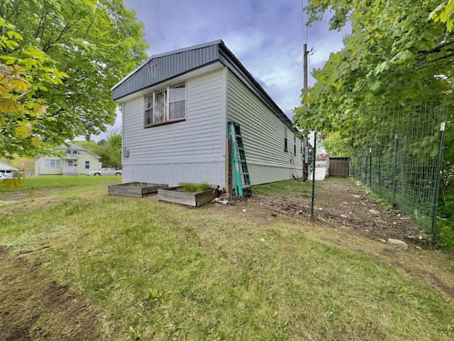 rear view of house featuring a garden