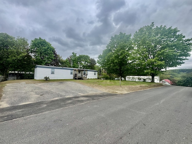 view of front of home with asphalt driveway