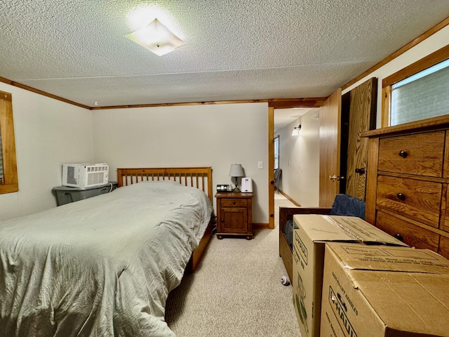 bedroom featuring light carpet and a textured ceiling