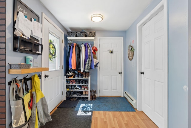 65 Lone Indian Trl, Augusta, ME 04330 - foyer entrance featuring a baseboard radiator and wood finished floors