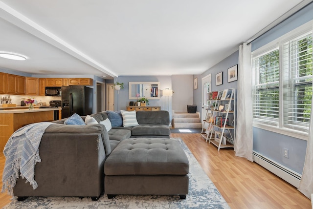 65 Lone Indian Trl, Augusta, ME 04330 - living room with a baseboard heating unit and light wood finished floors