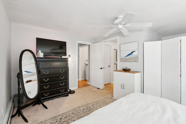 65 Lone Indian Trl, Augusta, ME 04330 - bedroom with baseboard heating, light colored carpet, and ceiling fan