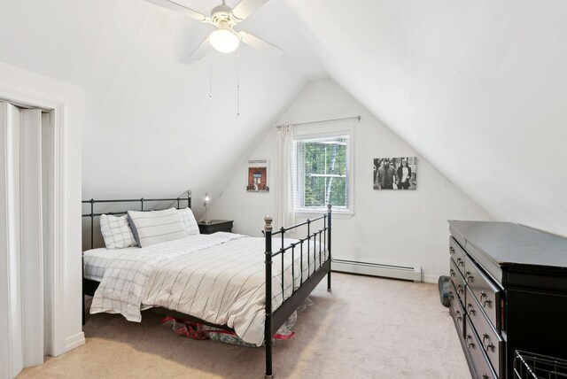 65 Lone Indian Trl, Augusta, ME 04330 - bedroom featuring baseboard heating, light colored carpet, vaulted ceiling, and a ceiling fan