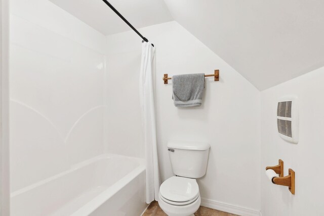 65 Lone Indian Trl, Augusta, ME 04330 - bathroom with vaulted ceiling, toilet, shower / tub combo with curtain, baseboards, and heating unit