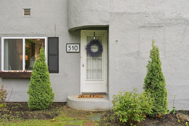 510 Minot Ave, Auburn, ME 04210 - doorway to property featuring stucco siding