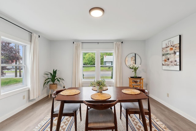 510 Minot Ave, Auburn, ME 04210 - dining area featuring plenty of natural light, light wood finished floors, and baseboards