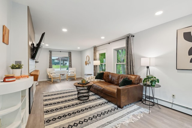 510 Minot Ave, Auburn, ME 04210 - living room featuring light wood-style floors, recessed lighting, a baseboard radiator, and baseboards