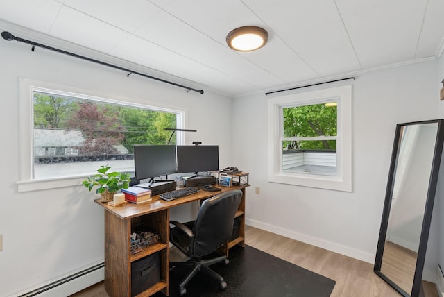 510 Minot Ave, Auburn, ME 04210 - home office with a baseboard heating unit, light wood-style floors, baseboards, and crown molding