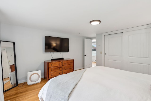 510 Minot Ave, Auburn, ME 04210 - bedroom featuring light wood-style flooring, baseboards, and a closet