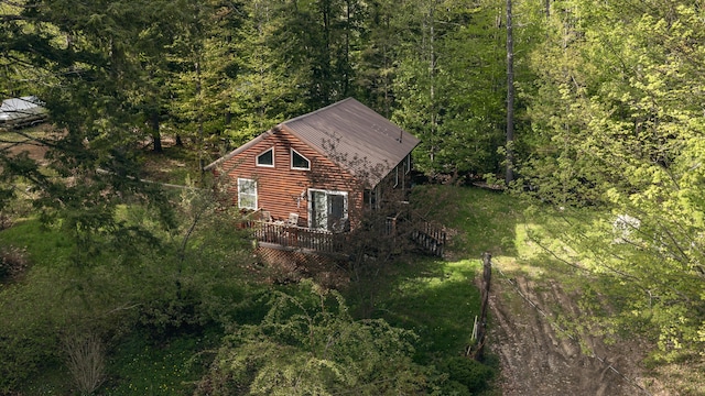 183 Pine Point Rd, Oxford, ME 04270 - view of home's exterior featuring a wooded view and a wooden deck