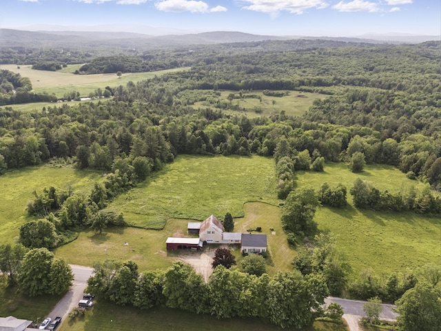 640 Lower St, Turner, ME 04282 - aerial overview of property's location with a mountainous background and a heavily wooded area