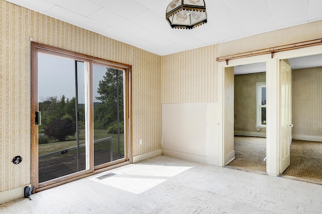 640 Lower St, Turner, ME 04282 - unfurnished room with wallpapered walls and baseboards