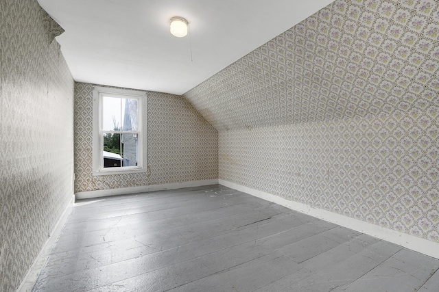 640 Lower St, Turner, ME 04282 - bonus room featuring wallpapered walls, lofted ceiling, and baseboards