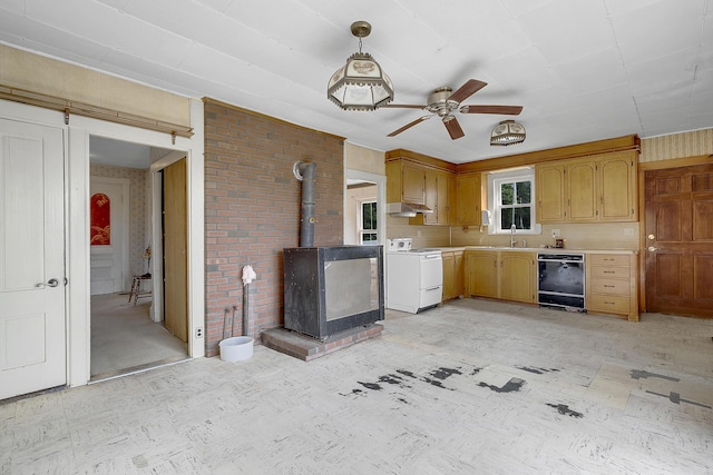 640 Lower St, Turner, ME 04282 - kitchen with dishwasher, stove, light countertops, a wood stove, and a ceiling fan