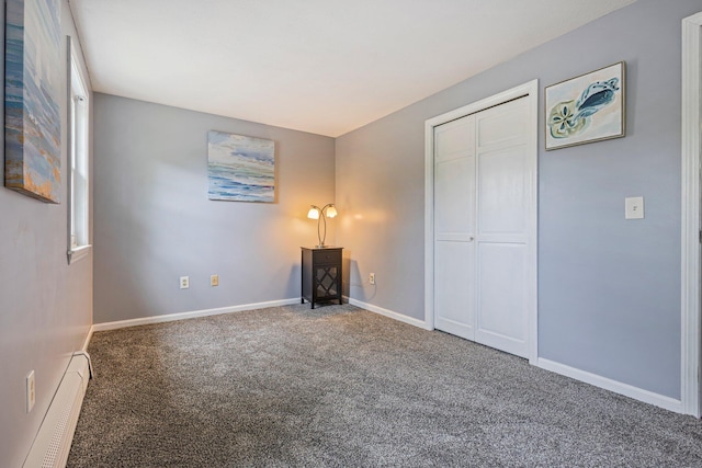 5 Jamestown Ct Unit 5, South Portland, ME 04106 - unfurnished bedroom with a baseboard heating unit, carpet, baseboards, and a closet