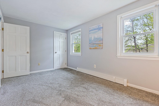 5 Jamestown Ct Unit 5, South Portland, ME 04106 - unfurnished bedroom featuring a baseboard heating unit, carpet floors, and baseboards