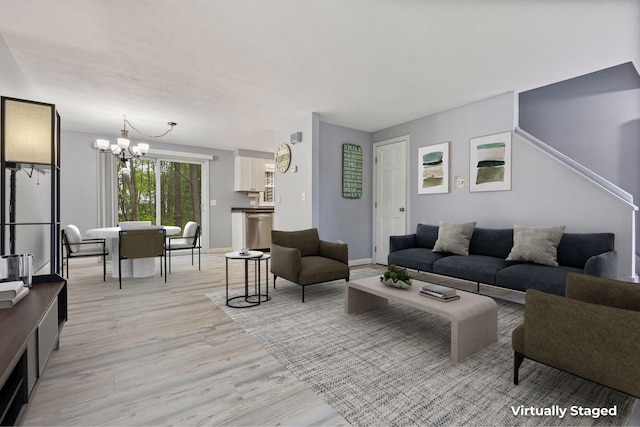 5 Jamestown Ct Unit 5, South Portland, ME 04106 - living area with a chandelier, light wood finished floors, and baseboards