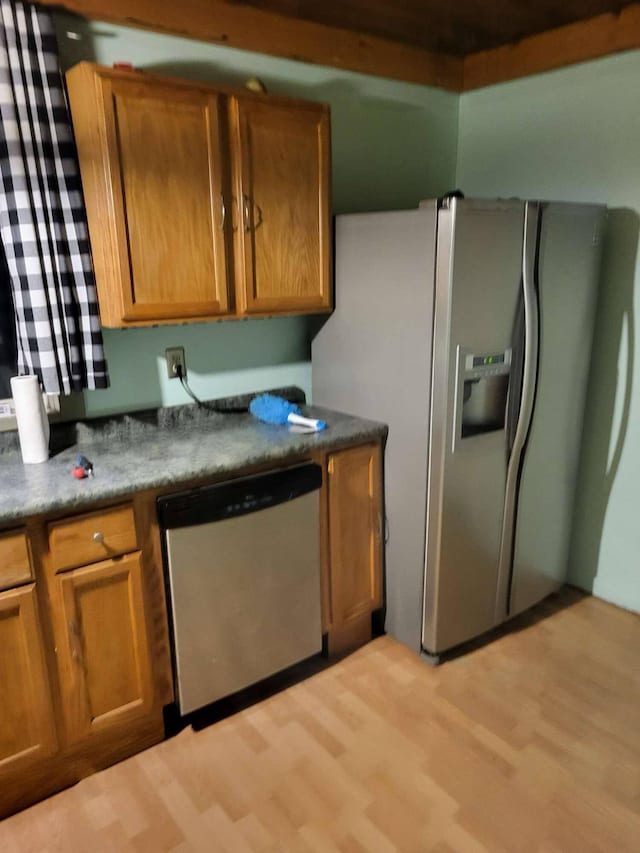458 Carding Machine Rd, Bowdoinham, ME 04008 - kitchen featuring appliances with stainless steel finishes, light wood-type flooring, and brown cabinets