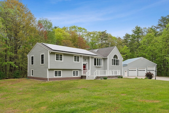 1 Whispering Pines Dr, Old Orchard Beach, ME 04064 - split foyer home with a detached garage, a front yard, and an outbuilding