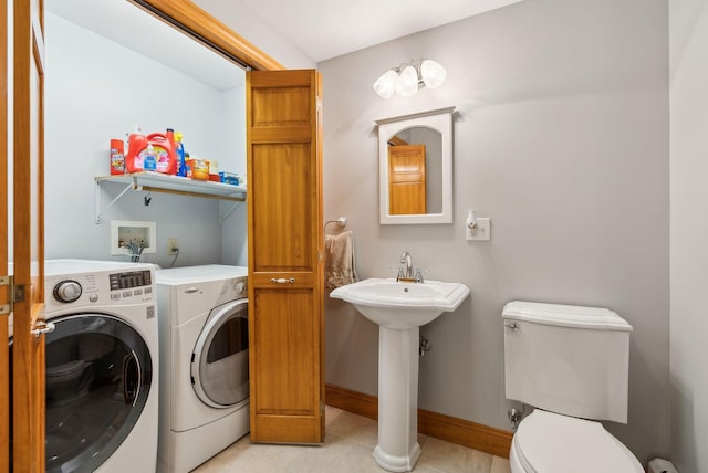 1 Whispering Pines Dr, Old Orchard Beach, ME 04064 - laundry room with separate washer and dryer, light tile patterned flooring, and baseboards