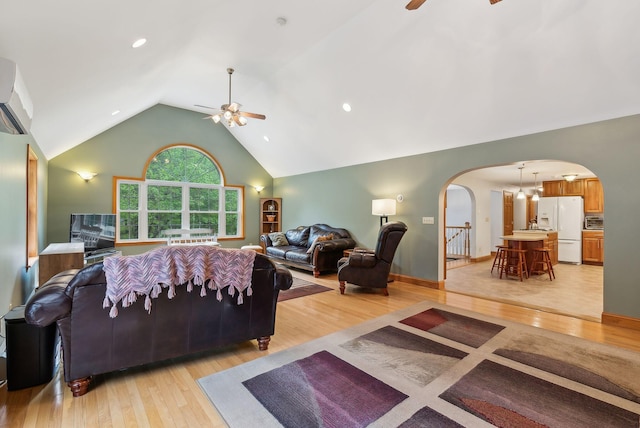 1 Whispering Pines Dr, Old Orchard Beach, ME 04064 - living room featuring ceiling fan, arched walkways, light wood-style flooring, and high vaulted ceiling