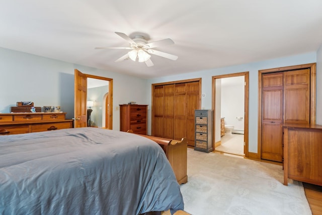 1 Whispering Pines Dr, Old Orchard Beach, ME 04064 - bedroom with connected bathroom, a ceiling fan, and a baseboard heating unit
