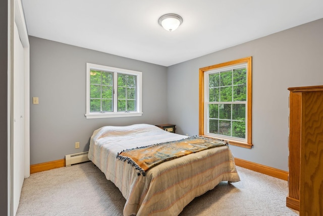 1 Whispering Pines Dr, Old Orchard Beach, ME 04064 - carpeted bedroom featuring multiple windows, baseboard heating, and baseboards