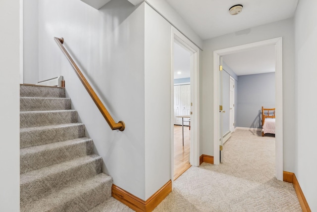 1 Whispering Pines Dr, Old Orchard Beach, ME 04064 - stairs with a baseboard heating unit, carpet flooring, and baseboards