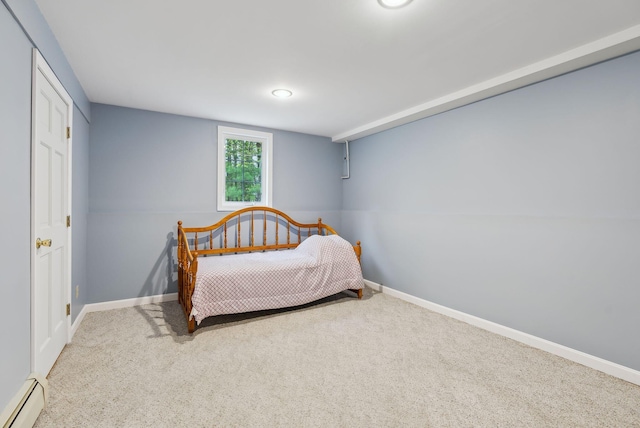 1 Whispering Pines Dr, Old Orchard Beach, ME 04064 - carpeted bedroom featuring a baseboard heating unit and baseboards