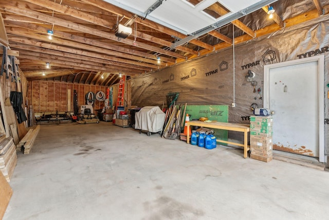 1 Whispering Pines Dr, Old Orchard Beach, ME 04064 - garage with a workshop area and a garage door opener