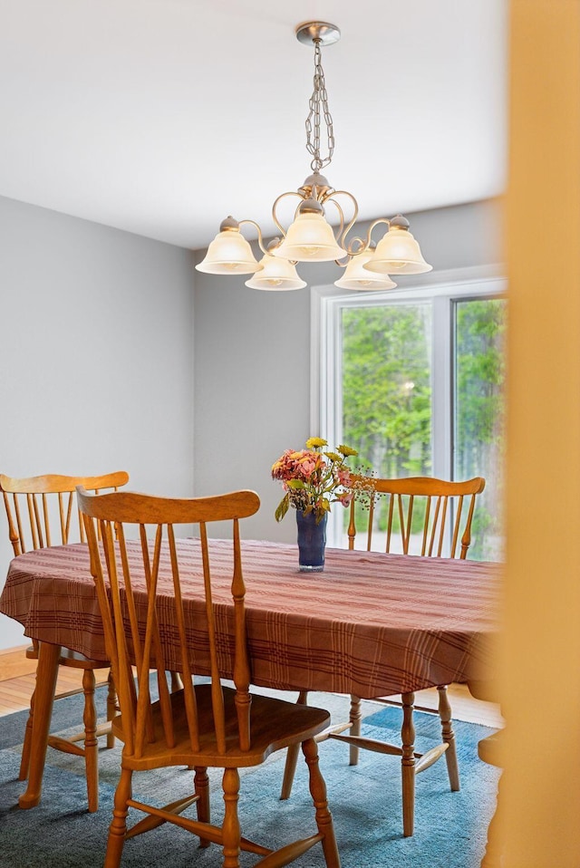 1 Whispering Pines Dr, Old Orchard Beach, ME 04064 - dining space with a chandelier