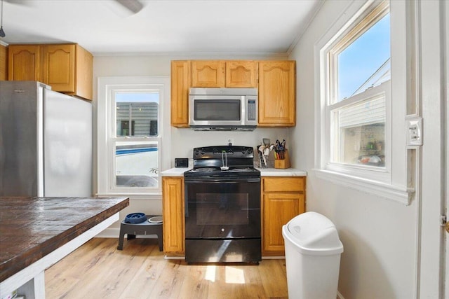 25 Biron Ave, Lewiston, ME 04240 - kitchen featuring stainless steel appliances, plenty of natural light, and light countertops