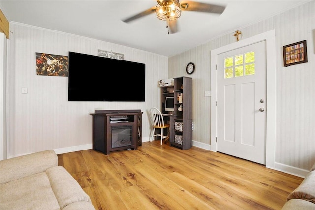 25 Biron Ave, Lewiston, ME 04240 - living room with crown molding, a ceiling fan, wood finished floors, and baseboards