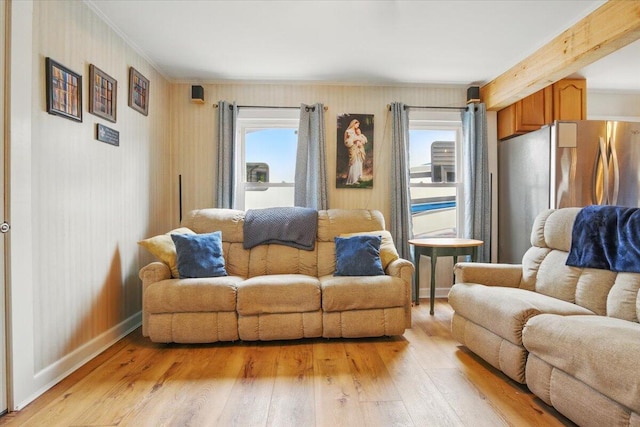 25 Biron Ave, Lewiston, ME 04240 - living area featuring light wood finished floors, ornamental molding, and baseboards