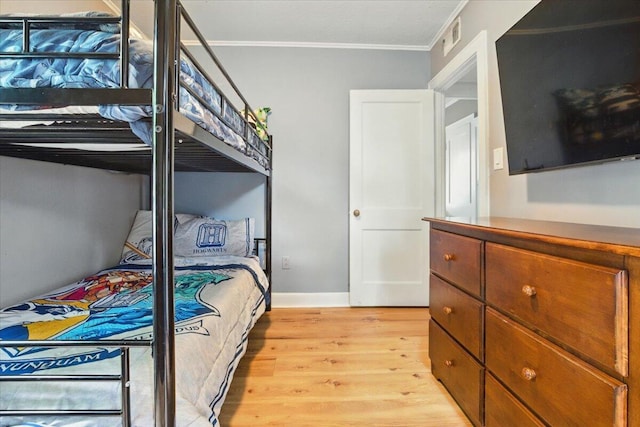 25 Biron Ave, Lewiston, ME 04240 - bedroom featuring light wood-style floors, ornamental molding, and baseboards