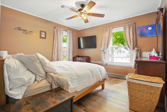 25 Biron Ave, Lewiston, ME 04240 - bedroom featuring ornamental molding, wood finished floors, baseboards, and ceiling fan