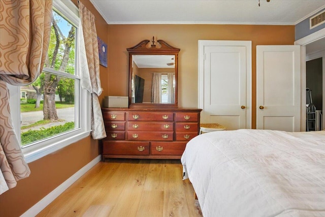 25 Biron Ave, Lewiston, ME 04240 - bedroom featuring light wood-style floors, baseboards, and ornamental molding