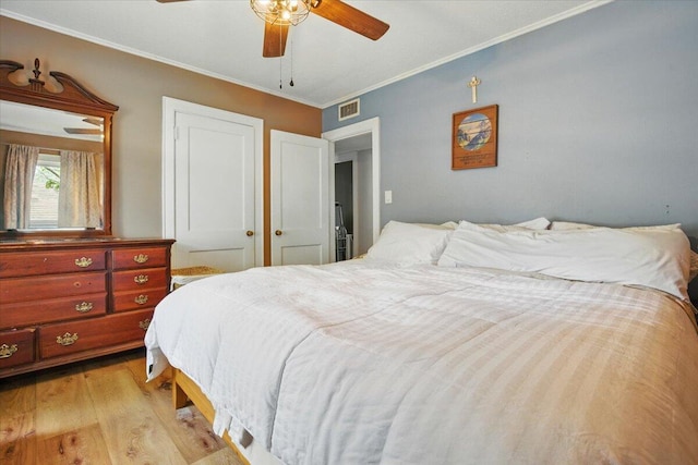 25 Biron Ave, Lewiston, ME 04240 - bedroom with light wood finished floors, ornamental molding, and ceiling fan