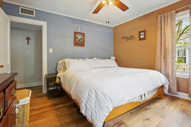 25 Biron Ave, Lewiston, ME 04240 - bedroom with ornamental molding, wood finished floors, baseboards, and ceiling fan