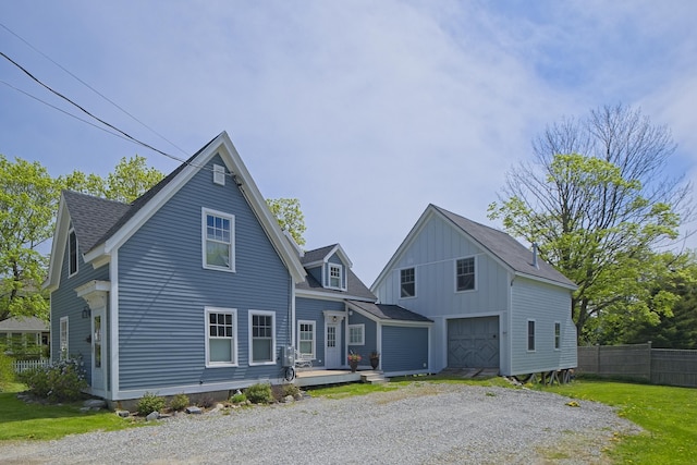 16 Cross St, Camden, ME 04843 - view of front of house with a garage, driveway, board and batten siding, a wooden deck, and roof with shingles