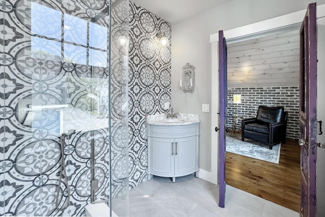 16 Cross St, Camden, ME 04843 - full bath featuring vanity, a stall shower, and an accent wall
