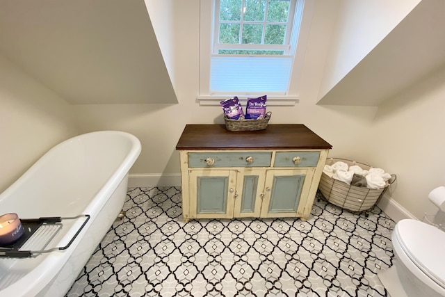 16 Cross St, Camden, ME 04843 - full bathroom with a freestanding bath, baseboards, and toilet