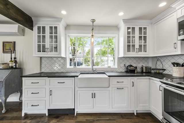 16 Cross St, Camden, ME 04843 - kitchen featuring a sink, a wall unit AC, appliances with stainless steel finishes, white cabinetry, and recessed lighting