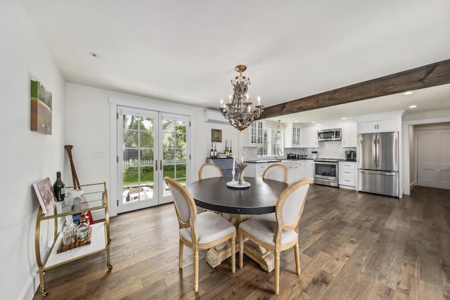 16 Cross St, Camden, ME 04843 - dining room featuring a chandelier, dark wood-style floors, a wall mounted AC, french doors, and recessed lighting